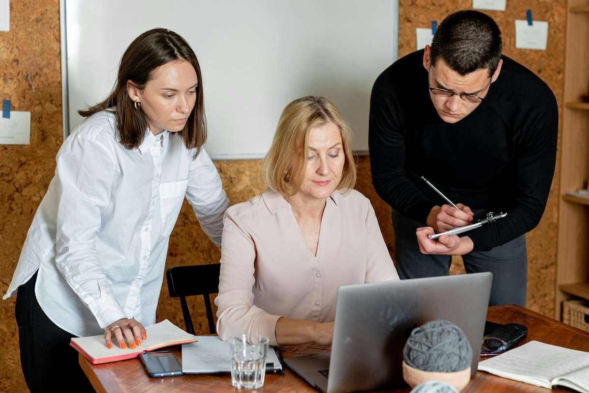 Women in sustainability with two people at a laptop screen